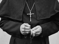 priest with crucifix