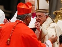 Pope Francis greets new Cardinal Mafi during consistory at which pope created 20 new cardinals in St. Peter’s Basilica at Vatican
