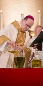 priest during mass Real Presence in Priest People masonry