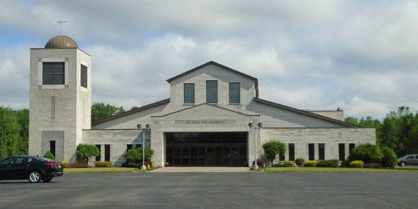 Saint Jude the Apostle Church Rochester NY white church black car sunny cloudy day