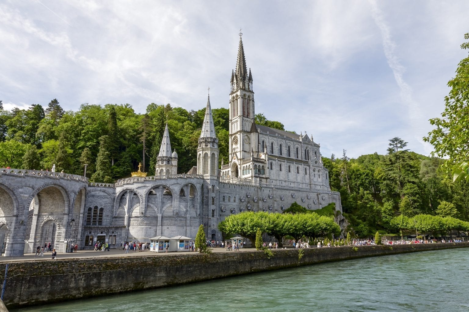 The Basilica of Lourdes at Gave de Pau river - Crossroads Initiative