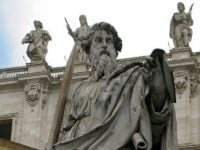 irenaeus statue in front of a church