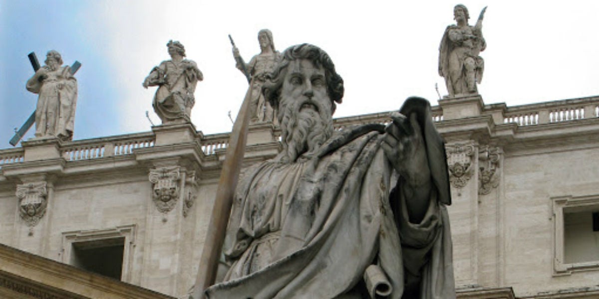 irenaeus statue in front of a church