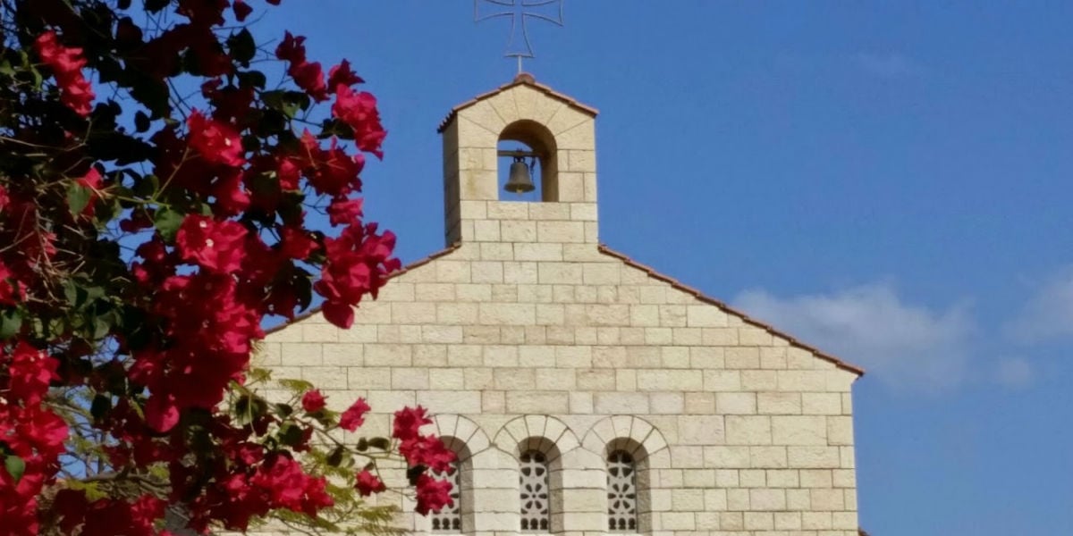 top of church with flowers Tabga heptageon loaves fish