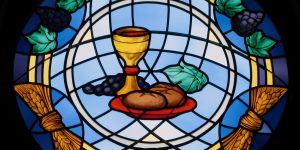 Thomas aquinas quotes sacrament eucharist body blood stained glass chalice wine bread summa theologiae